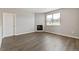 Living room with fireplace and wood floors at 13497 Valentia St, Thornton, CO 80602