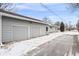 Attached two car garage with driveway and gray paint at 6240 W 24Th Ave, Edgewater, CO 80214