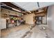 Spacious garage with ample storage shelving and visible rafters at 6240 W 24Th Ave, Edgewater, CO 80214