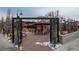 Inviting outdoor patio with metal decor, featuring tables, chairs, and overhead string lights at 6240 W 24Th Ave, Edgewater, CO 80214