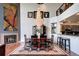 Open concept dining area with a fireplace and elegant chandelier, perfect for entertaining guests at 1900 E Girard Pl # 901, Englewood, CO 80113