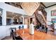 Chandelier lit dining area with view into kitchen and spiral staircase to upper level at 1900 E Girard Pl # 901, Englewood, CO 80113