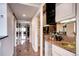 Hallway area featuring a mirrored wet bar, marble floors, and access to other rooms at 1900 E Girard Pl # 901, Englewood, CO 80113