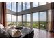 Bright living room featuring oversized windows with picturesque views and contemporary finishes at 1900 E Girard Pl # 901, Englewood, CO 80113