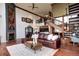 Living room boasts a spiral staircase, fireplace, and open layout with modern design at 1900 E Girard Pl # 901, Englewood, CO 80113