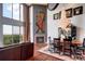 Bright living room with spiral staircase, chandelier, fireplace, and hardwood floors at 1900 E Girard Pl # 901, Englewood, CO 80113