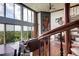 Bright living room featuring spiral staircase, oversized windows with scenic views and hardwood floors at 1900 E Girard Pl # 901, Englewood, CO 80113