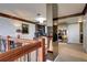 Open loft area with custom built-ins, natural light, and a glimpse of the chandelier at 1900 E Girard Pl # 901, Englewood, CO 80113