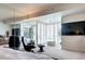 Bright main bedroom features a seating area and large windows with shutter blinds at 1900 E Girard Pl # 901, Englewood, CO 80113