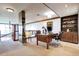 Spacious home office with custom bookshelves, a large desk, and ambient lighting at 1900 E Girard Pl # 901, Englewood, CO 80113