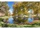 Beautiful pond with clear water reflecting the surrounding trees, creating a serene and picturesque view at 1900 E Girard Pl # 901, Englewood, CO 80113
