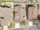 An aerial view outlines the home's property with neighboring homes, revealing the layout of the house and yard at 2590 S Independence St, Lakewood, CO 80227