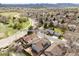 An aerial view showcases the house with clubhouse and pool in the distance, as well as address 2590 south independence street at 2590 S Independence St, Lakewood, CO 80227