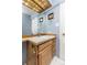Well-lit bathroom with a wood-trimmed vanity and a large mirror at 2590 S Independence St, Lakewood, CO 80227