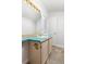 Bathroom with colorful countertop, brass fixtures, and modern sink at 2590 S Independence St, Lakewood, CO 80227