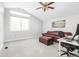 Bright living room features a couch, ottoman, desk, and large window for lots of light at 2590 S Independence St, Lakewood, CO 80227
