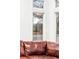 Cozy living room with a view of the exterior neighborhood through the large, bright window at 2590 S Independence St, Lakewood, CO 80227