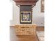 Close up of a fireplace surrounded by brick and finished with hardwood flooring at 2590 S Independence St, Lakewood, CO 80227