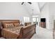 Spacious main bedroom with vaulted ceilings, walk-out access, and a large dresser with television at 2590 S Independence St, Lakewood, CO 80227