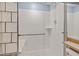 Bright shower with glass enclosure and tiled walls at 2590 S Independence St, Lakewood, CO 80227