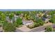 A scenic aerial view of a suburban neighborhood showcasing lush greenery, and mountain views in the background at 3907 E 133Rd Ct, Thornton, CO 80241