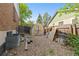 Fenced backyard with shed and some building supplies at 3907 E 133Rd Ct, Thornton, CO 80241