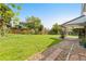 Backyard featuring a covered patio and garden area at 3907 E 133Rd Ct, Thornton, CO 80241
