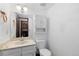 Simple white bathroom with vanity, toilet, and white walls at 3907 E 133Rd Ct, Thornton, CO 80241