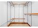 Walk-in closet featuring a metal shelving system with wooden accents, offering ample storage space at 3907 E 133Rd Ct, Thornton, CO 80241