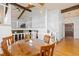 Dining room featuring wood furniture, hardwood floors, and an upper-level overlook with white railing at 3907 E 133Rd Ct, Thornton, CO 80241