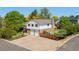 Charming two-story home with brick accents, a two-car garage, and a beautifully landscaped front yard at 3907 E 133Rd Ct, Thornton, CO 80241