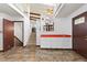 Living area featuring tile flooring, staircase and bar with red countertop at 3907 E 133Rd Ct, Thornton, CO 80241