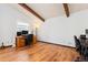 Office space with hardwood floors, large window, and desk setup at 3907 E 133Rd Ct, Thornton, CO 80241