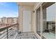 Modern balcony with railing and sliding glass door at 10111 Inverness Main St # 312, Englewood, CO 80112