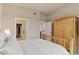 Bright bedroom features neutral walls and carpet, wardrobe, and walk-in closet at 10111 Inverness Main St # 312, Englewood, CO 80112