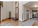 Elegant lobby area with tiled floor, artwork, seating, and an elevator, offering a welcoming entrance at 10111 Inverness Main St # 312, Englewood, CO 80112