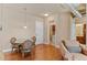 Cozy dining area with hardwood floors and a clear view into the kitchen and living area at 10111 Inverness Main St # 312, Englewood, CO 80112