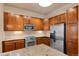 Modern kitchen with granite countertops, stainless steel appliances, and plenty of cabinet storage at 10111 Inverness Main St # 312, Englewood, CO 80112