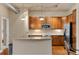 Well-lit kitchen showcases sleek appliances, ample cabinet space, and stylish granite countertops at 10111 Inverness Main St # 312, Englewood, CO 80112