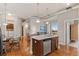 Modern kitchen with granite countertops, stainless steel appliances, and an island with seating at 10111 Inverness Main St # 312, Englewood, CO 80112
