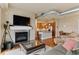 Spacious open concept living room with fireplace, kitchen, and dining area at 10111 Inverness Main St # 312, Englewood, CO 80112