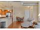 Bright living space with open kitchen, stainless appliances, dining area, and living space at 10111 Inverness Main St # 312, Englewood, CO 80112