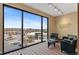 Modern office with oversized windows showcasing city views and comfortable seating at 10111 Inverness Main St # 312, Englewood, CO 80112