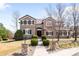 Beautiful two-story home featuring a landscaped front yard, walkway, and stylish architectural details at 8390 Coyote Dr, Castle Pines, CO 80108