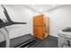 Home gym featuring a treadmill and a sauna for a convenient wellness space at 8390 Coyote Dr, Castle Pines, CO 80108