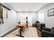Modern office space features a sit-stand desk, multiple monitors, and ample storage at 8390 Coyote Dr, Castle Pines, CO 80108