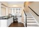 Charming study nook with built-in cabinets, granite countertops, and a convenient location near the stairs at 8390 Coyote Dr, Castle Pines, CO 80108