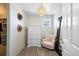 Cozy walk-in closet with chair, dresser, and mirror at 8390 Coyote Dr, Castle Pines, CO 80108