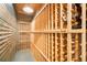 Custom wine cellar featuring extensive wood racking and ample storage space for wine bottles at 8390 Coyote Dr, Castle Pines, CO 80108
