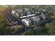 Stunning aerial view of a modern housing community with unique architecture surrounded by lush greenery at 532 Lombardi Cir, Louisville, CO 80027